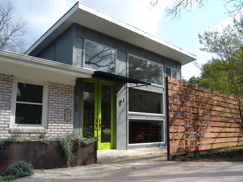 Photo of a contemporary one-storey brick exterior in Austin.