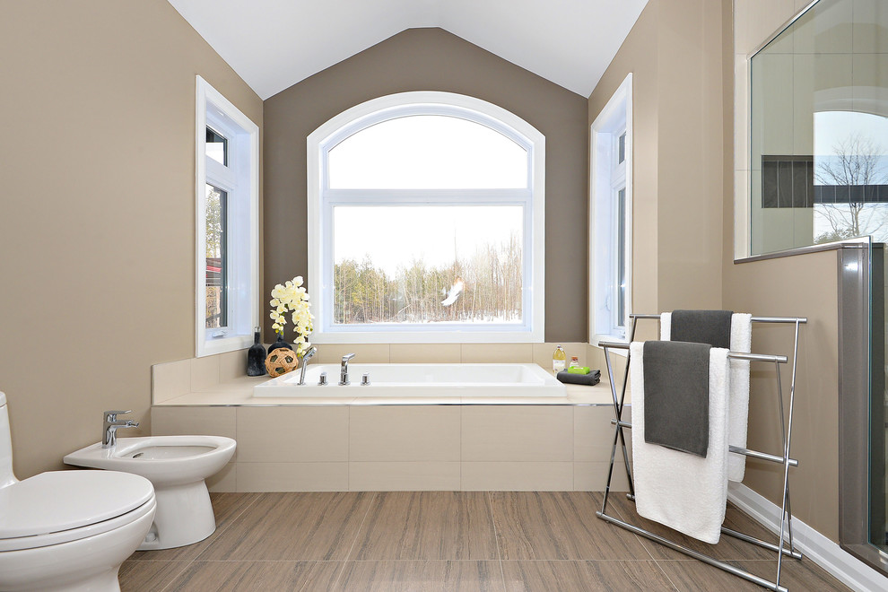 Mid-sized contemporary master bathroom in Ottawa with flat-panel cabinets, white cabinets, beige tile, porcelain tile, beige walls, porcelain floors, an undermount sink, engineered quartz benchtops and brown floor.