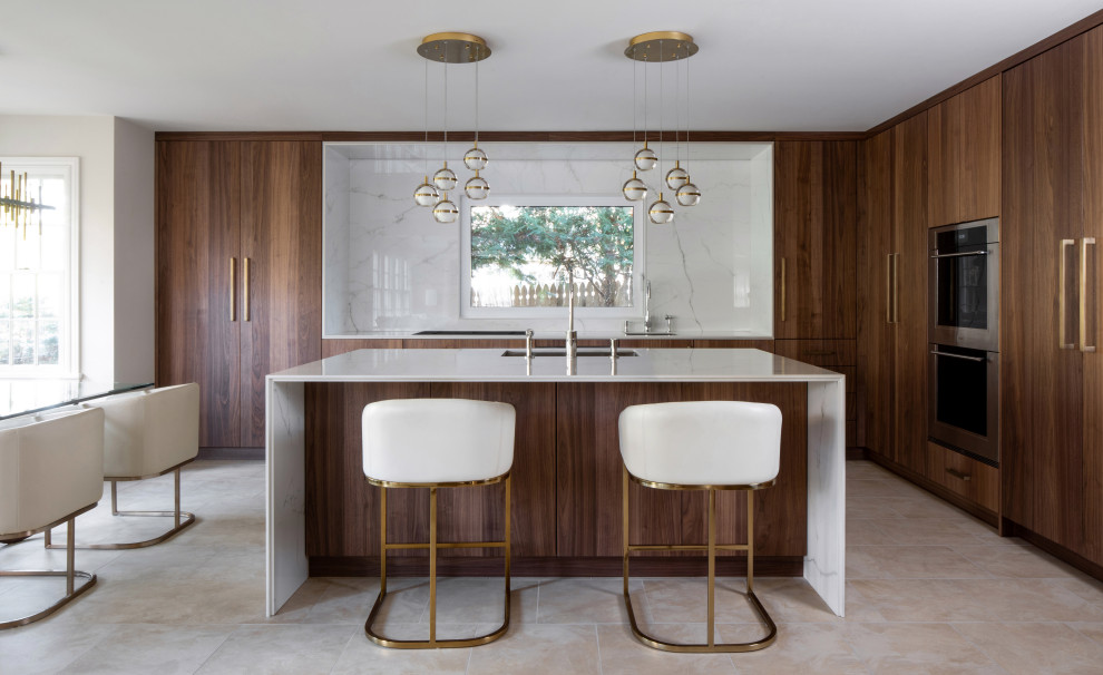 Photo of a mid-sized modern l-shaped eat-in kitchen in New York with an undermount sink, flat-panel cabinets, dark wood cabinets, white splashback, panelled appliances, porcelain floors, with island, beige floor and white benchtop.