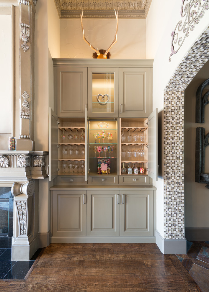 Mid-sized traditional single-wall home bar in Dallas with no sink, raised-panel cabinets, grey cabinets, dark hardwood floors and brown floor.