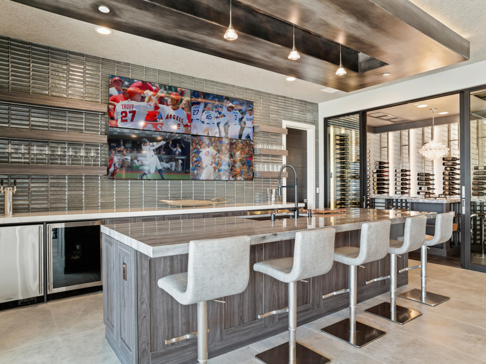 Inspiration for a medium sized contemporary wine cellar in Orange County with ceramic flooring, display racks, beige floors and a feature wall.
