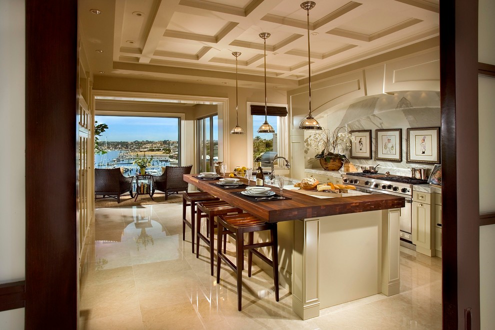 Photo of a large contemporary single-wall open plan kitchen in Orange County with recessed-panel cabinets, beige cabinets, white splashback, stainless steel appliances, dark hardwood floors and with island.