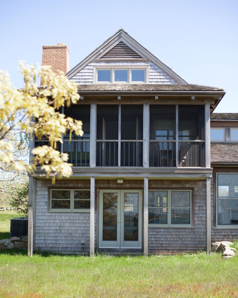 Large beach style three-storey exterior in Boston with wood siding and a gable roof.