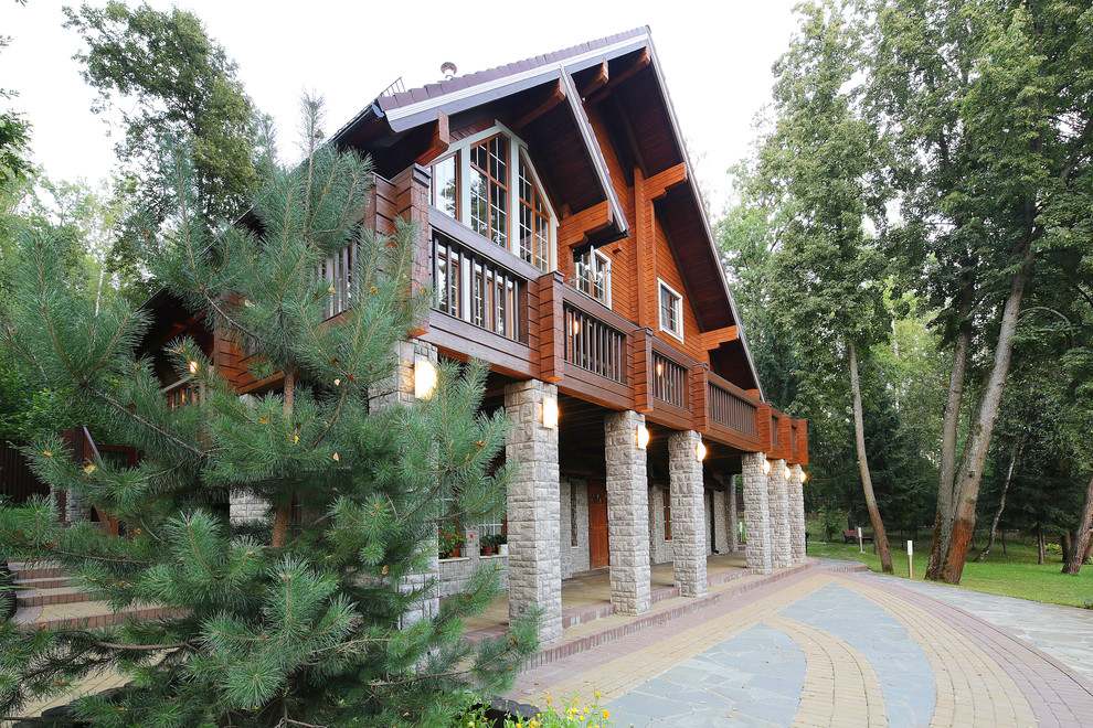 Дом из клееного бруса с цокольным этажом и американской террасой