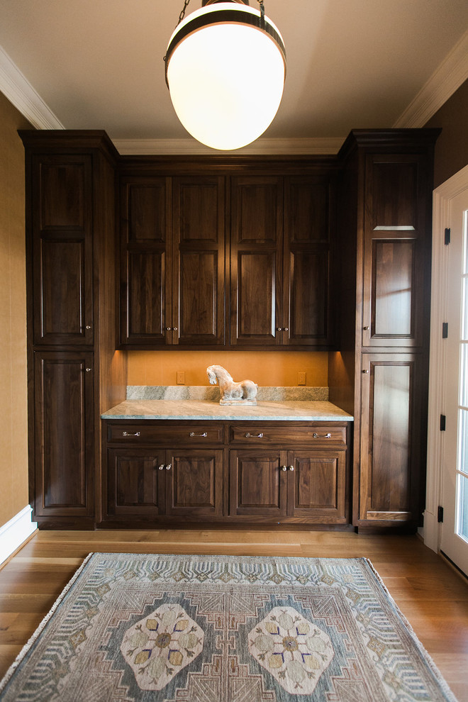 Inspiration for a small transitional single-wall separate kitchen in Baltimore with an undermount sink, raised-panel cabinets, dark wood cabinets, granite benchtops, medium hardwood floors, no island and brown floor.