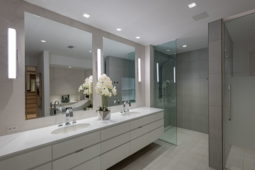 Contemporary master bathroom in Seattle with flat-panel cabinets, white cabinets, a curbless shower, gray tile, an undermount sink, grey floor and an open shower.