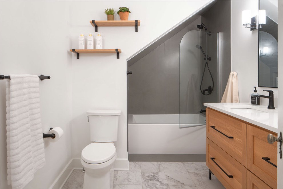 Inspiration for a mid-sized transitional gray tile and porcelain tile porcelain tile, white floor and double-sink alcove bathtub remodel in Columbus with shaker cabinets, light wood cabinets, a two-piece toilet, white walls, an undermount sink, quartz countertops, a hinged shower door, white countertops and a built-in vanity