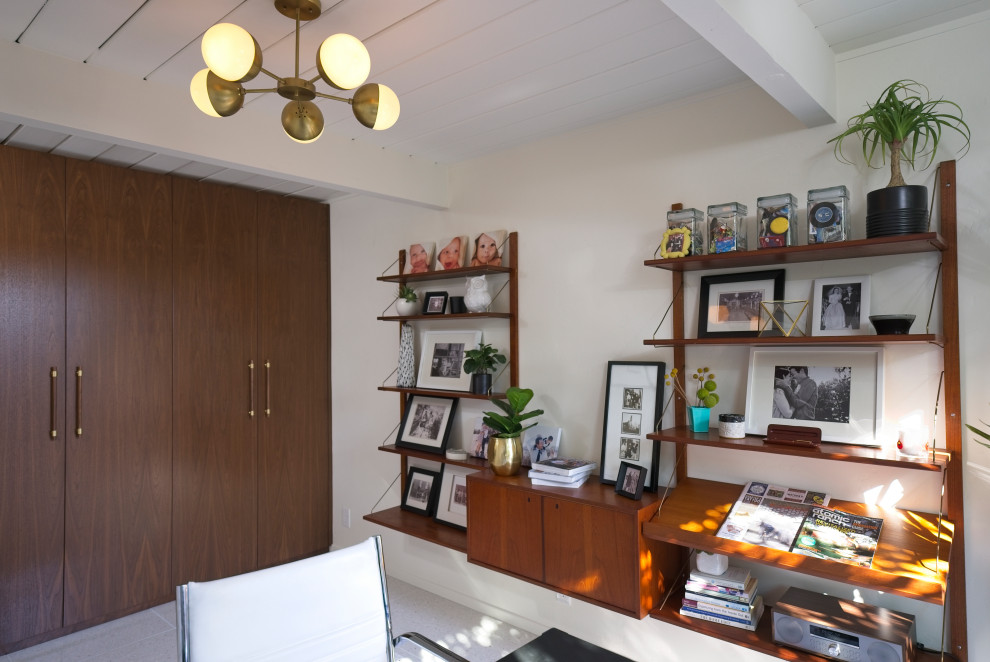 Photo of a medium sized midcentury study in Orange County with white walls, a freestanding desk, beige floors and a wood ceiling.