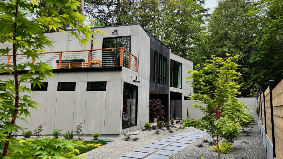 Large urban gray two-story concrete fiberboard exterior home photo in Seattle
