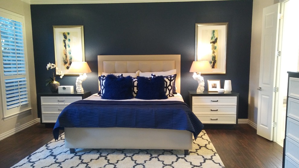 This is an example of a mid-sized transitional master bedroom in Dallas with blue walls, porcelain floors, no fireplace and brown floor.
