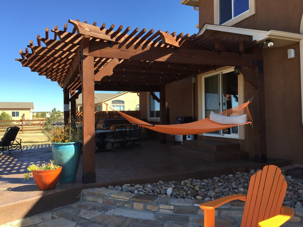 Example of a mountain style home design design in Denver