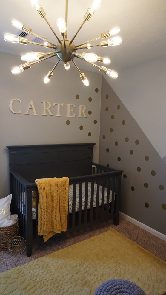 This is an example of a small modern nursery for boys in Houston with grey walls, carpet and beige floor.