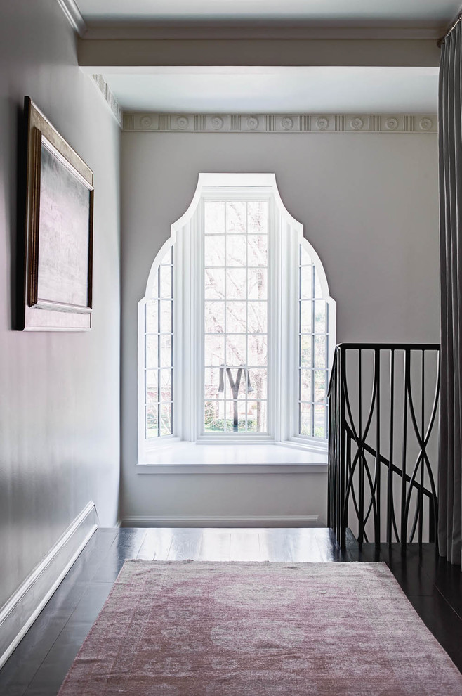 Inspiration for a large transitional hallway in Charlotte with grey walls and medium hardwood floors.