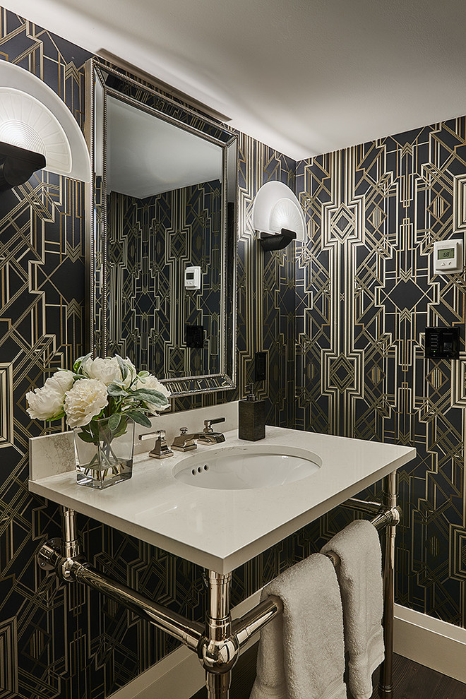 Powder room - small transitional brown floor powder room idea with multicolored walls and a console sink