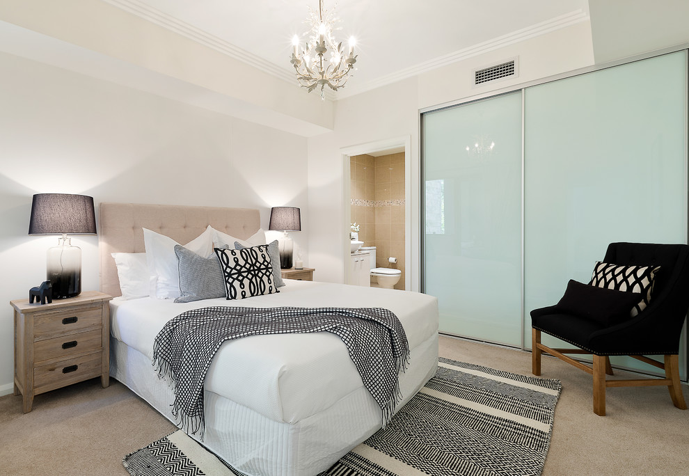 Inspiration for a small contemporary master bedroom in Sydney with beige walls, carpet and beige floor.