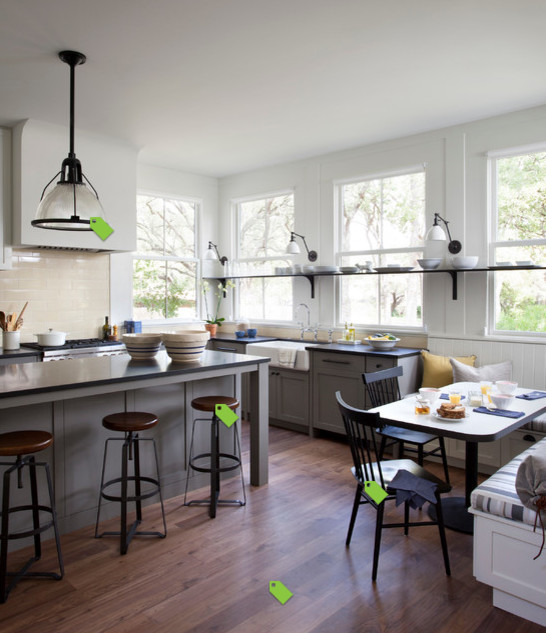 Inspiration for a mid-sized rustic single-wall porcelain tile eat-in kitchen remodel with a farmhouse sink, subway tile backsplash, stainless steel appliances and two islands