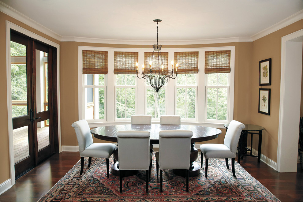 Photo of a large transitional separate dining room in Minneapolis with beige walls, medium hardwood floors, no fireplace and brown floor.