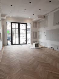 Chevron hardwood flooring & new doors/windows