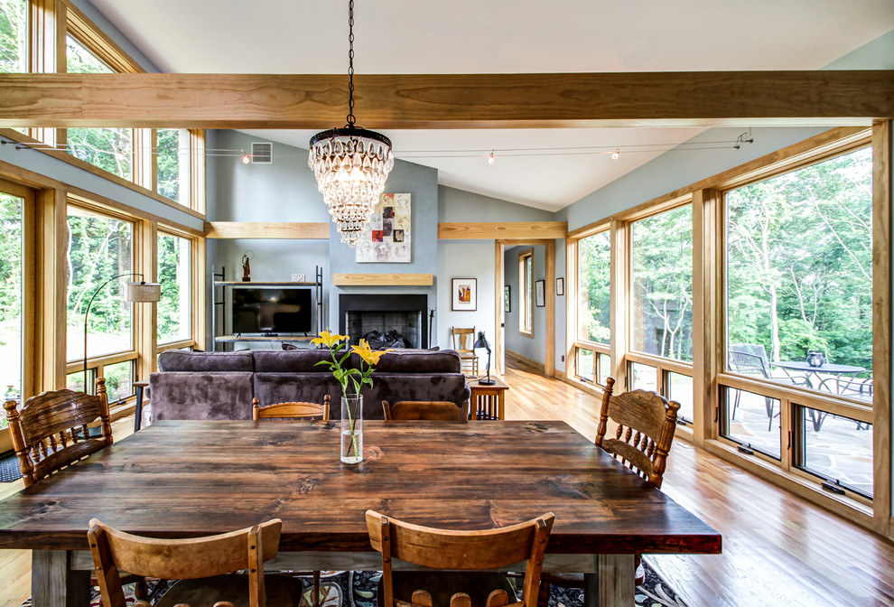 Large transitional l-shaped eat-in kitchen in Other with a farmhouse sink, shaker cabinets, white cabinets, concrete benchtops, stainless steel appliances, light hardwood floors and no island.