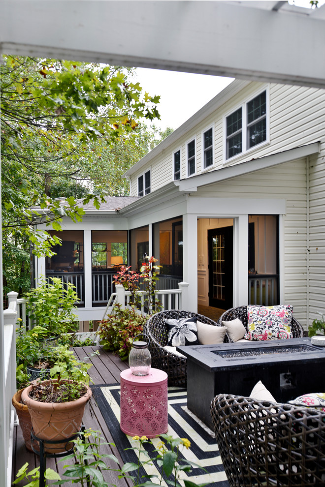 Inspiration for an expansive modern backyard screened-in verandah in DC Metro with a pergola.