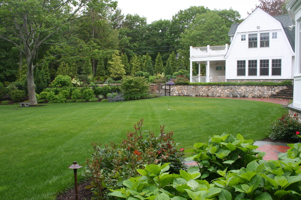 Inspiration for an expansive traditional backyard garden in Manchester.
