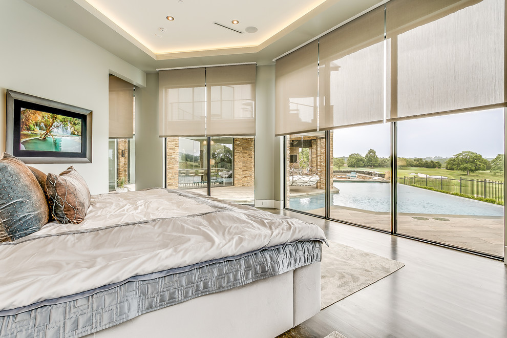 Design ideas for a contemporary master bedroom in Dallas with dark hardwood floors and grey walls.