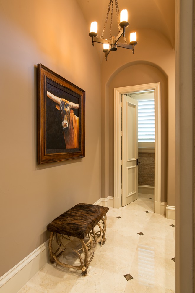 Design ideas for a large country hallway in Dallas with beige walls and marble floors.