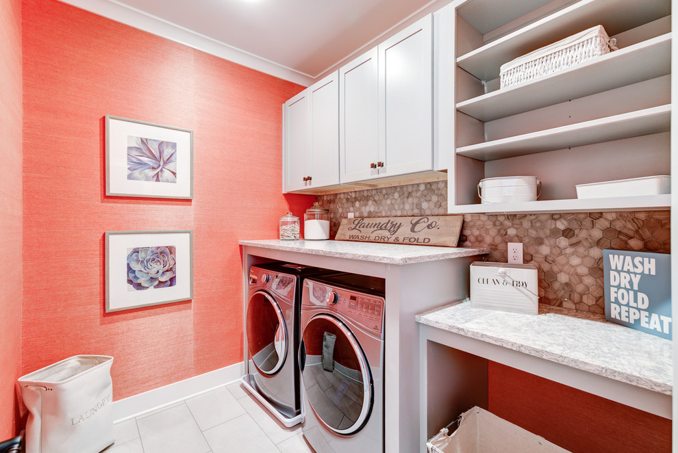 Photo of a mid-sized country single-wall dedicated laundry room in Richmond with shaker cabinets, grey cabinets, quartz benchtops, orange walls, ceramic floors, a side-by-side washer and dryer and beige floor.