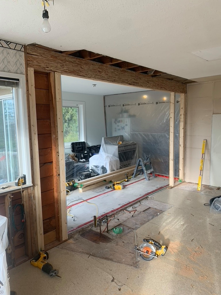 Remove wall and install beam. Install new kitchen.