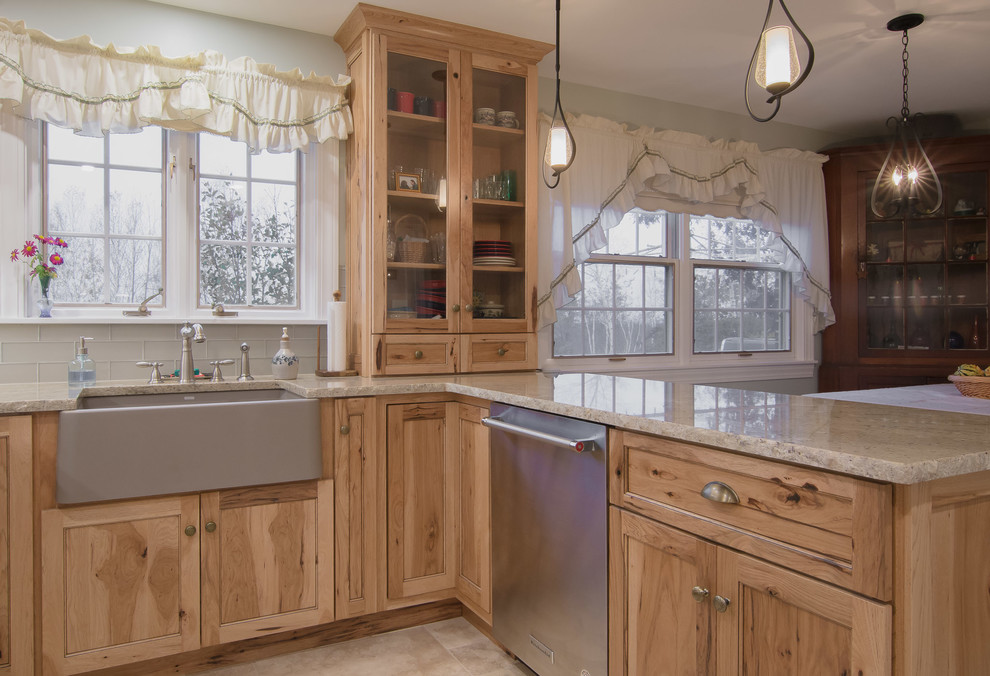 Mountain style ceramic tile and beige floor kitchen photo in Boston with a farmhouse sink, shaker cabinets, light wood cabinets, granite countertops, gray backsplash, subway tile backsplash and stainless steel appliances
