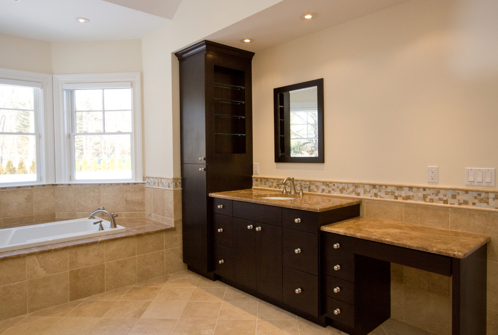 Drop-in bathtub - large transitional master beige tile and mosaic tile porcelain tile drop-in bathtub idea with flat-panel cabinets, black cabinets, beige walls, an undermount sink and granite countertops