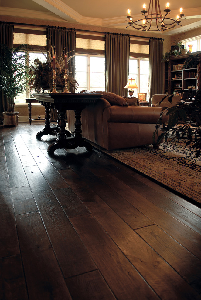 Inspiration for a traditional living room in Chicago with dark hardwood floors, brown floor, coffered and wallpaper.