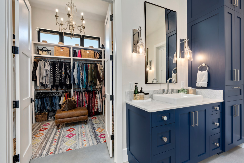 Design ideas for an expansive classic ensuite bathroom in Other with blue cabinets, a freestanding bath, a corner shower, multi-coloured tiles, white walls, an open shower, a shower bench, double sinks and a built in vanity unit.