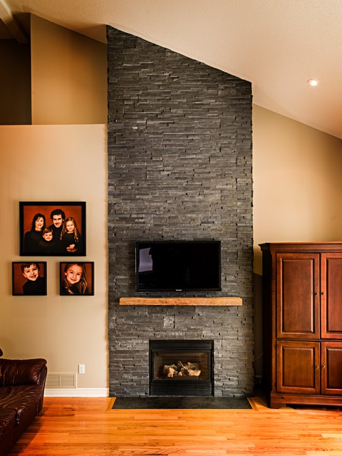 Dark Stone Veneer Fireplace with Wood Mantel - Traditional - Family ...