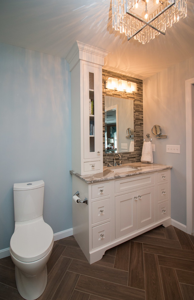 Inspiration for a mid-sized modern master bathroom in Boston with beaded inset cabinets, white cabinets, an alcove shower, a two-piece toilet, multi-coloured tile, porcelain tile, blue walls, porcelain floors, an undermount sink, engineered quartz benchtops, brown floor, brown benchtops and a hinged shower door.