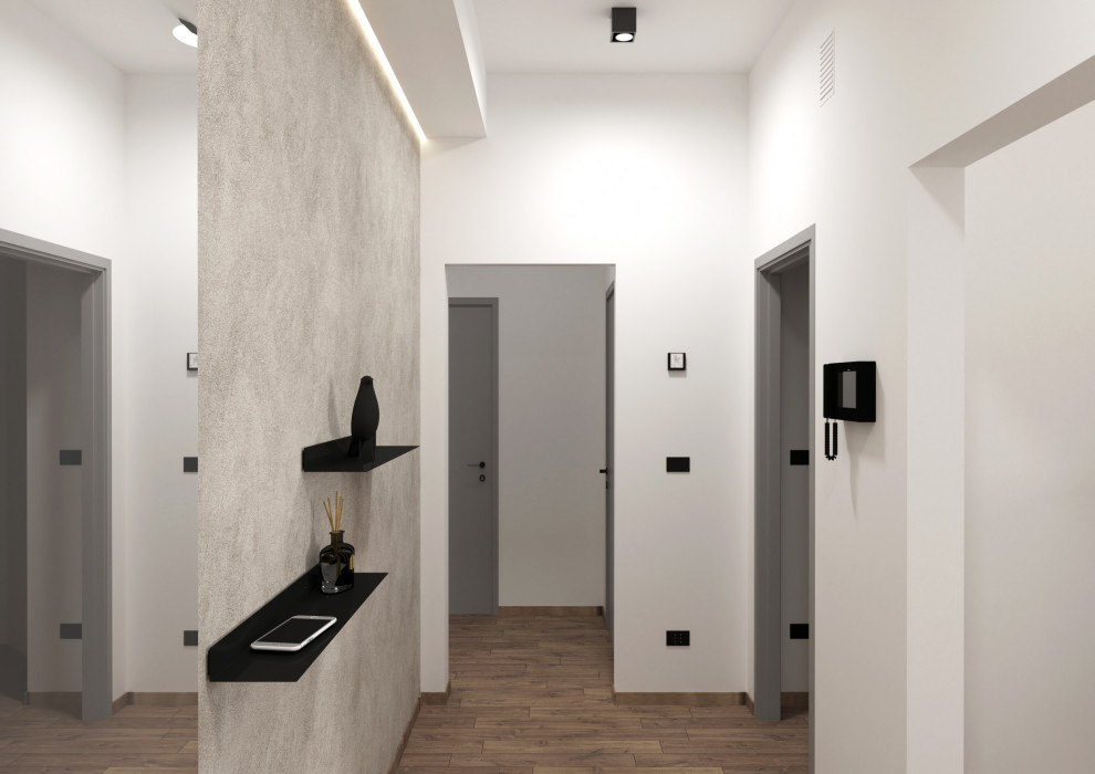 Kleines Modernes Foyer mit weißer Wandfarbe, dunklem Holzboden, Einzeltür, weißer Haustür, braunem Boden und eingelassener Decke in Mailand
