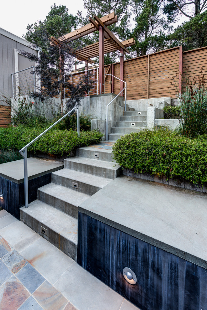 Design ideas for a contemporary front yard partial sun garden in San Francisco with a retaining wall.