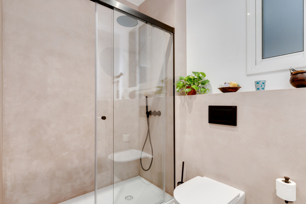 This is an example of a small modern master bathroom in Barcelona with furniture-like cabinets, brown cabinets, a curbless shower, a wall-mount toilet, a sliding shower screen, a niche, a single vanity and a floating vanity.