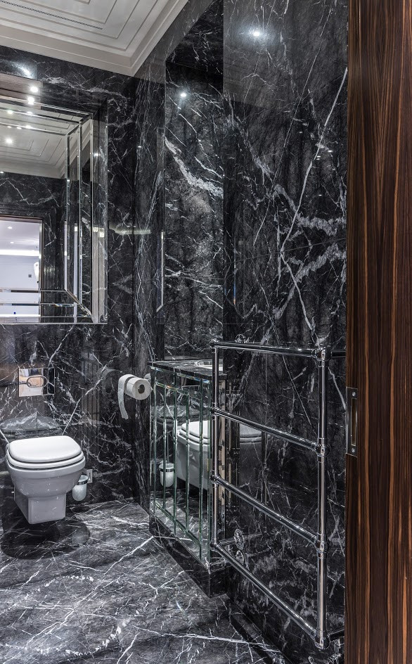 Design ideas for a small eclectic master bathroom in London with glass-front cabinets, an open shower, a wall-mount toilet, black tile, marble, black walls, marble floors, an undermount sink, marble benchtops, black floor, a hinged shower door, black benchtops, a single vanity and a built-in vanity.