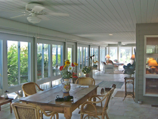 Large sunroom in Other with ceramic floors, no fireplace and a standard ceiling.
