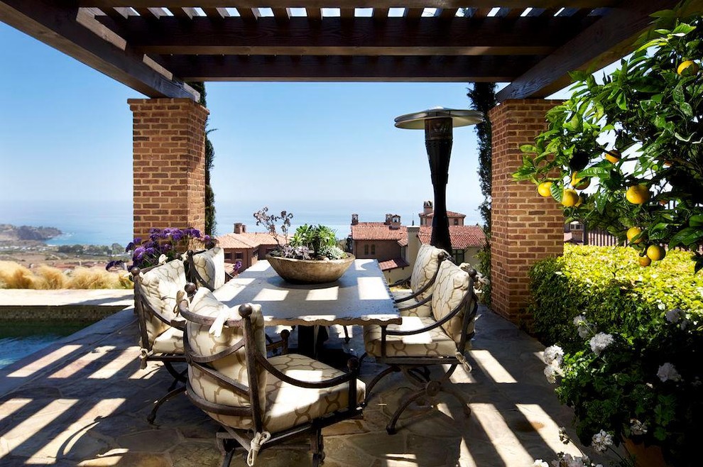 Photo of a traditional patio in Los Angeles with a pergola.
