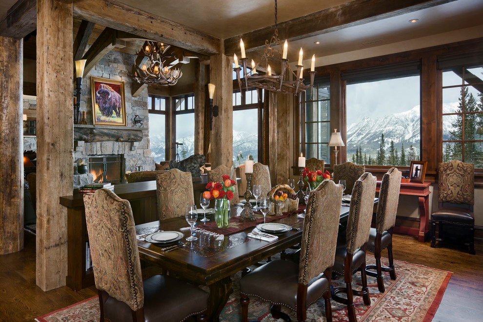 Country open plan dining in Other with dark hardwood floors.
