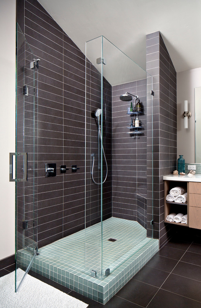 Contemporary bathroom in San Diego with flat-panel cabinets, light wood cabinets, an alcove shower, brown tile and a freestanding tub.