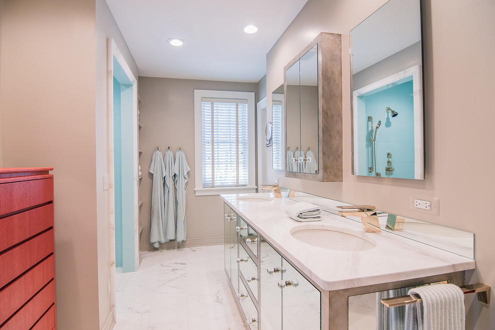 Example of a mid-sized transitional master blue tile and porcelain tile marble floor and white floor alcove shower design with flat-panel cabinets, beige walls, an undermount sink and marble countertops