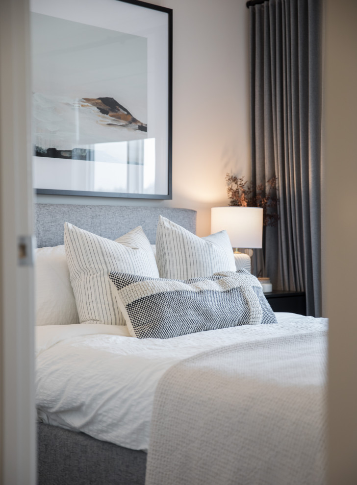 Bedroom - mid-sized scandinavian guest bedroom idea in Calgary with beige walls