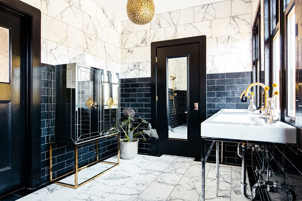 Design ideas for an expansive contemporary master bathroom in San Francisco with a claw-foot tub, an open shower, a one-piece toilet, black and white tile, stone tile, marble floors, a console sink and an open shower.