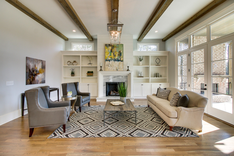 This is an example of a country formal enclosed living room in Nashville with grey walls, medium hardwood floors, a standard fireplace, a tile fireplace surround and brown floor.