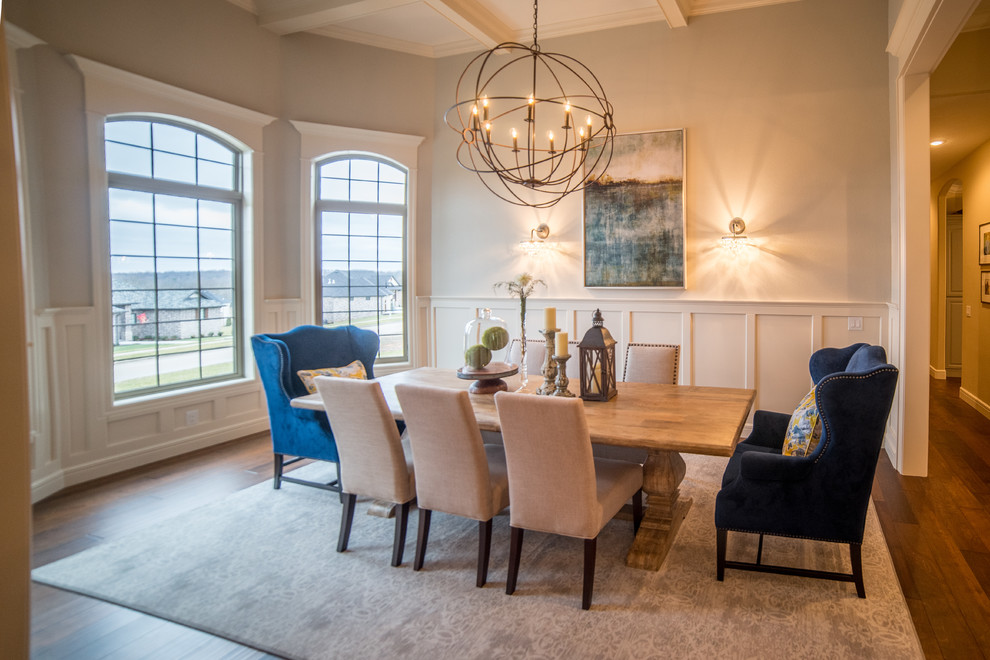 Inspiration for a large transitional dark wood floor dining room remodel with beige walls and no fireplace