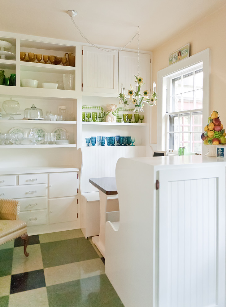 Traditional eat-in kitchen in Nashville with open cabinets, white cabinets and green floor.