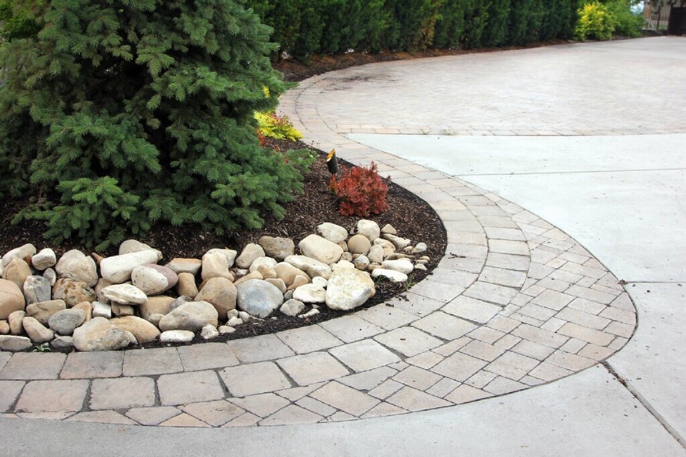 Design ideas for a traditional front yard driveway in Salt Lake City with with path and brick pavers.